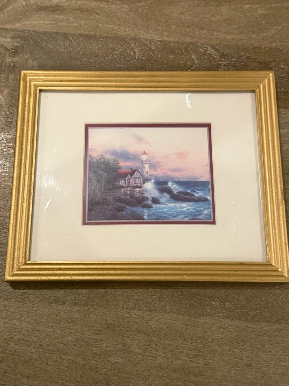 Thomas Kinkade Gold Framed Lighthouse Print with Blue Sky and White Clouds